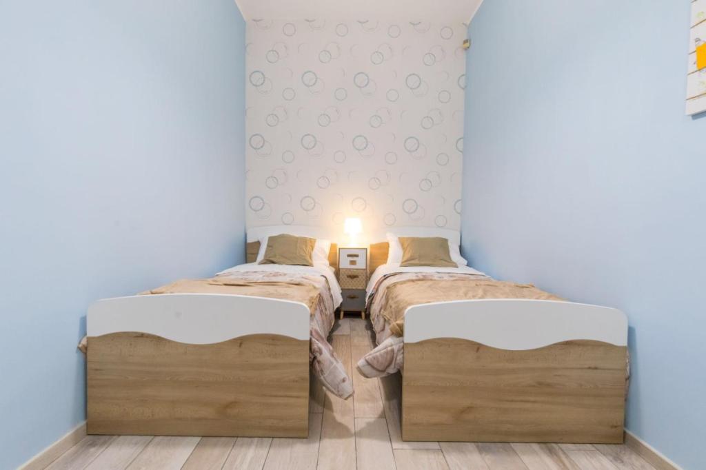 Postel nebo postele na pokoji v ubytování B&b Il miglio d’oro