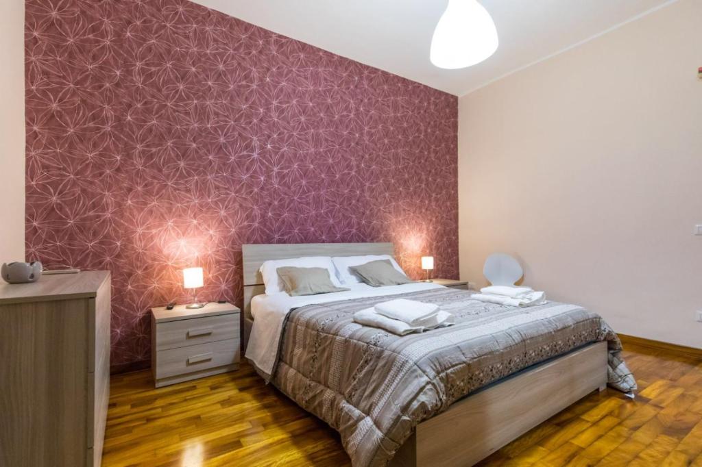 Postel nebo postele na pokoji v ubytování B&b Il miglio d’oro