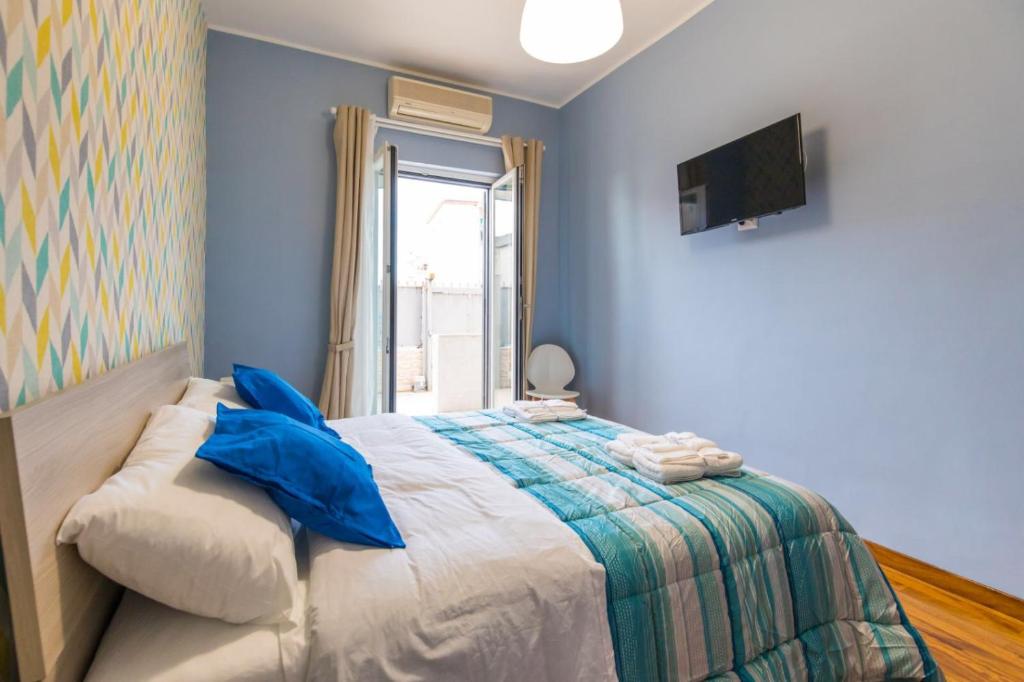 Postel nebo postele na pokoji v ubytování B&b Il miglio d’oro