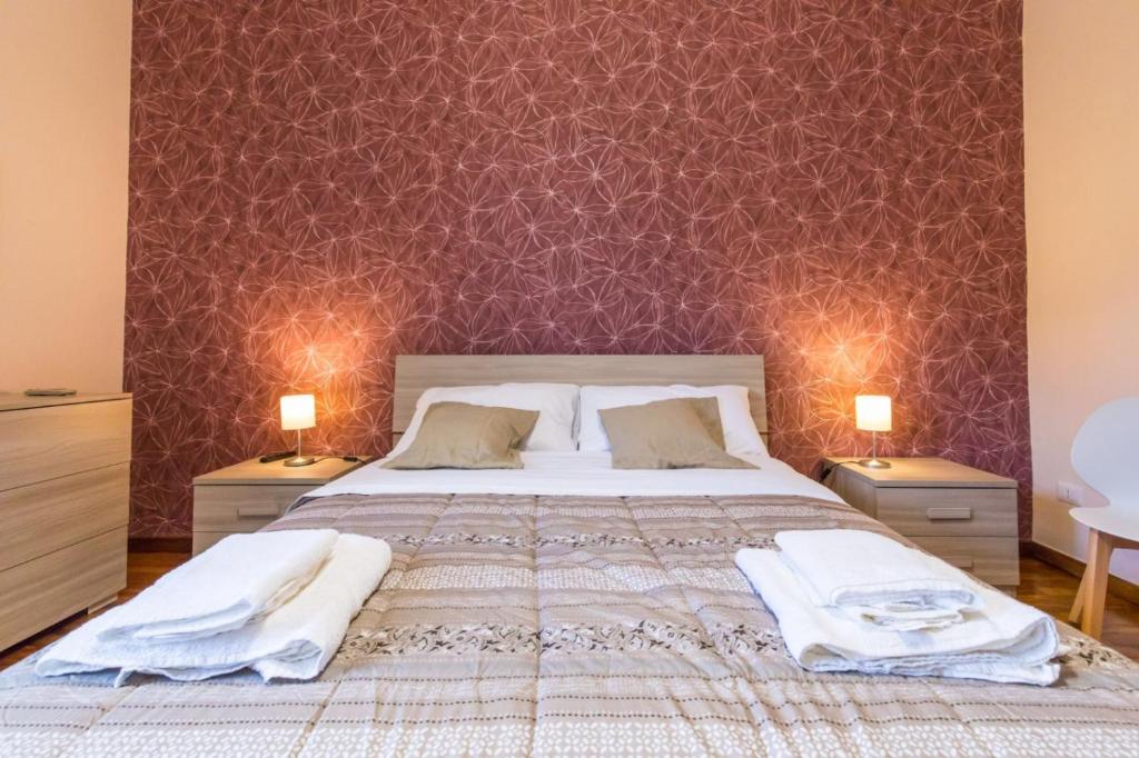 Postel nebo postele na pokoji v ubytování B&b Il miglio d’oro