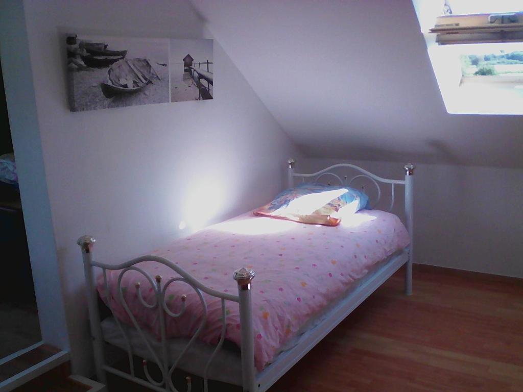 Postel nebo postele na pokoji v ubytování Gîte Lézardrieux