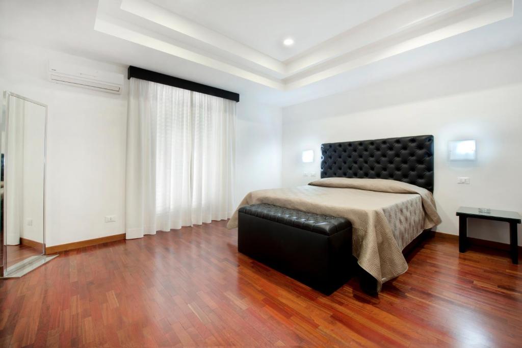 Postel nebo postele na pokoji v ubytování Hotel Quadrifoglio Roma Eur