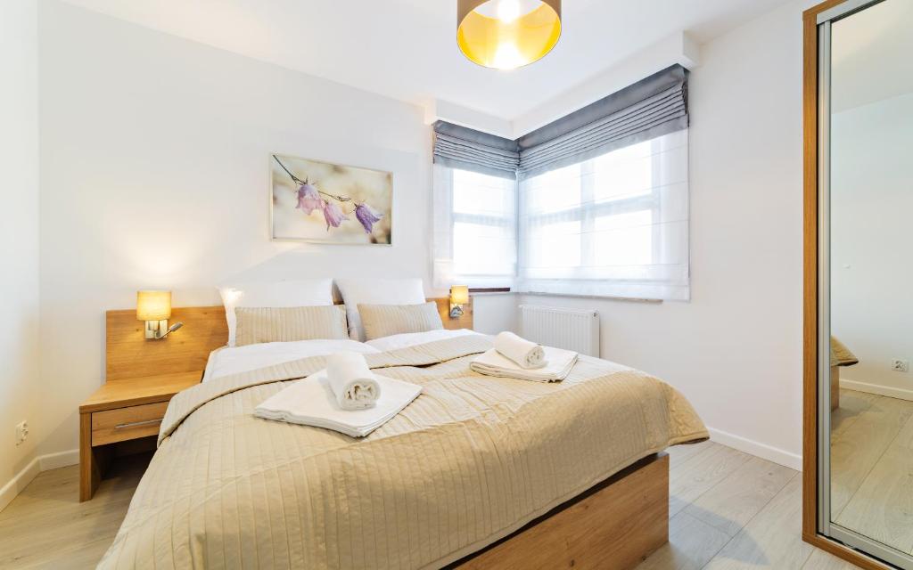 Posteľ alebo postele v izbe v ubytovaní Apartamenty Sun & Snow Residence Karpacz