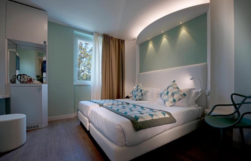 Postel nebo postele na pokoji v ubytování Ark Hotel