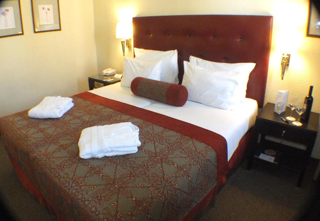 Postel nebo postele na pokoji v ubytování Prima Kings Hotel