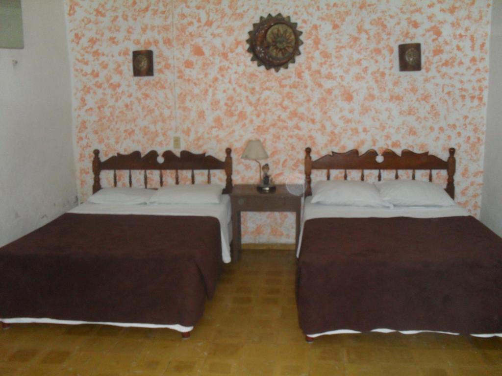 Postel nebo postele na pokoji v ubytování Hotel San Jose