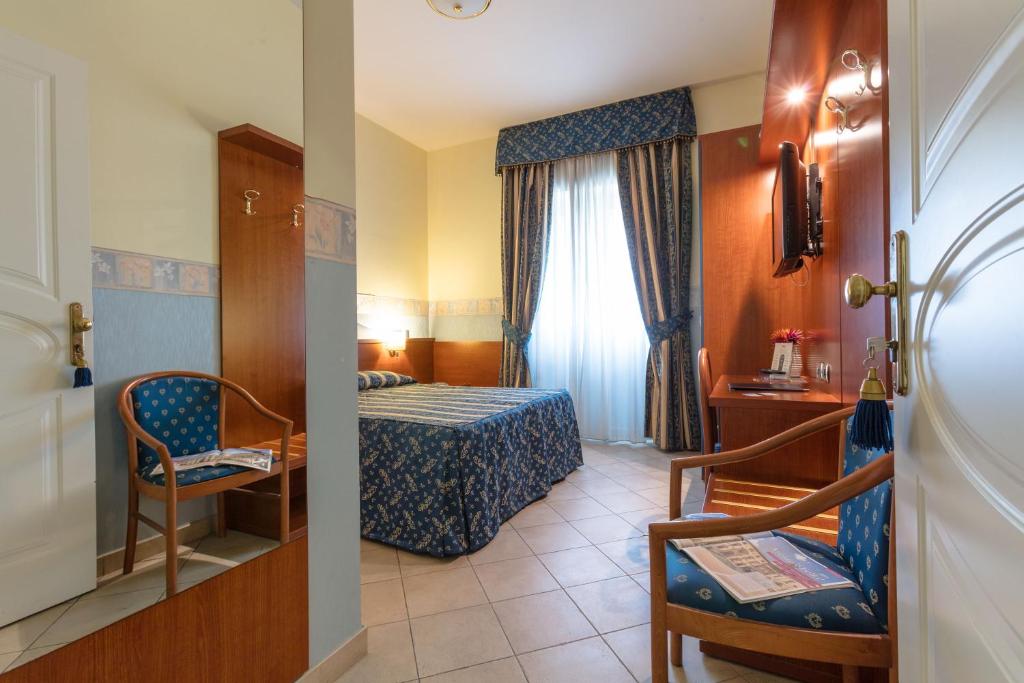 Postel nebo postele na pokoji v ubytování Hotel Borgo Del Mare