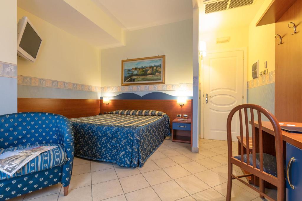 Postel nebo postele na pokoji v ubytování Hotel Borgo Del Mare