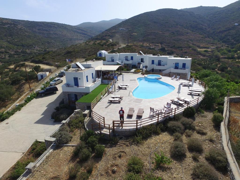 an aerial view of a villa with a swimming pool at Amorgion Village in Katapola