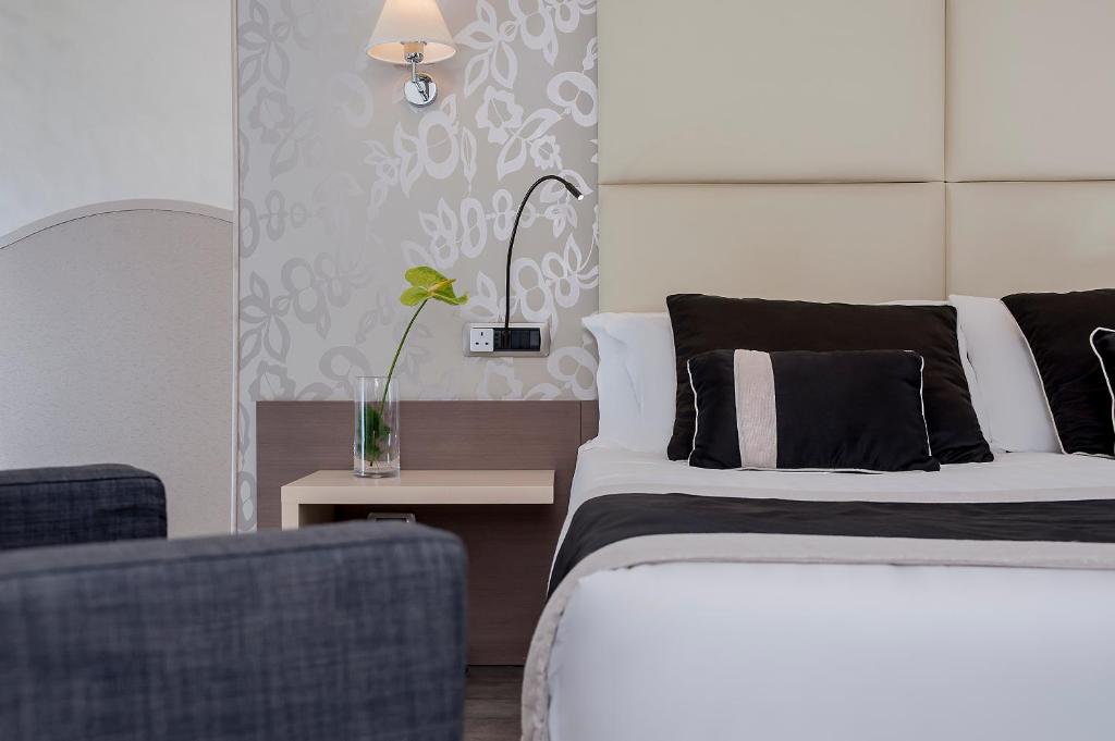 Postel nebo postele na pokoji v ubytování Demetra Hotel