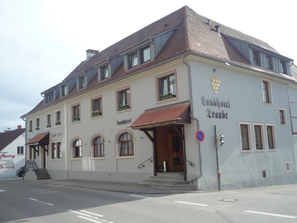 a large white building on the side of a street at Landhotel Traube in Konstanz