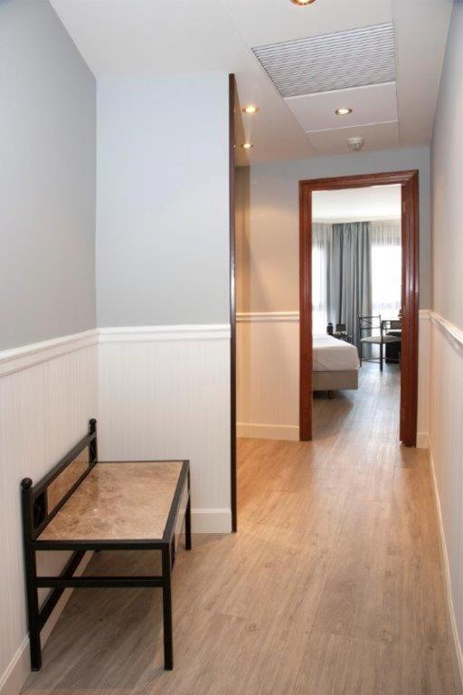 Postel nebo postele na pokoji v ubytování Hotel Gran Via