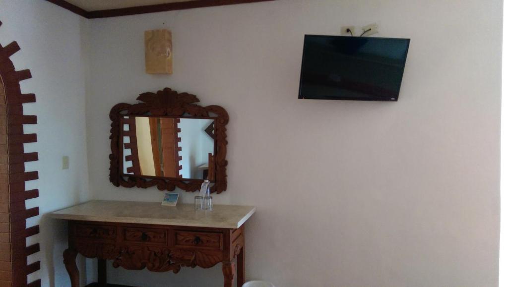 TV a/nebo společenská místnost v ubytování Ecotel Quinta Regia