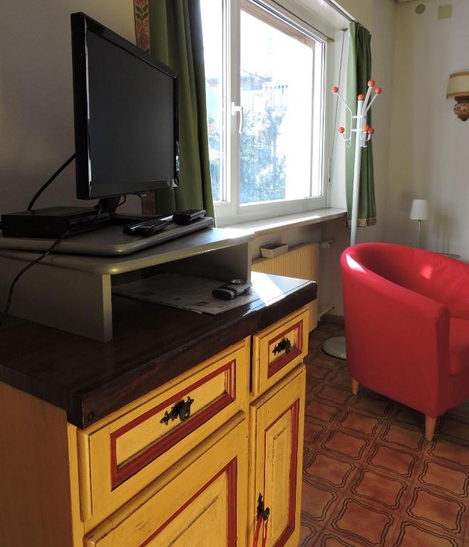 Televízia a/alebo spoločenská miestnosť v ubytovaní De Prealon Apartment