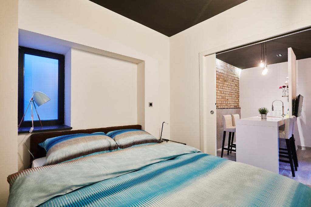 Posteľ alebo postele v izbe v ubytovaní Apartment and Rooms Marinac