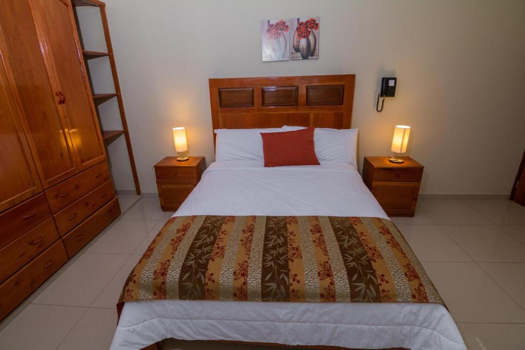 Postel nebo postele na pokoji v ubytování La Floresta Tarapoto Hostal