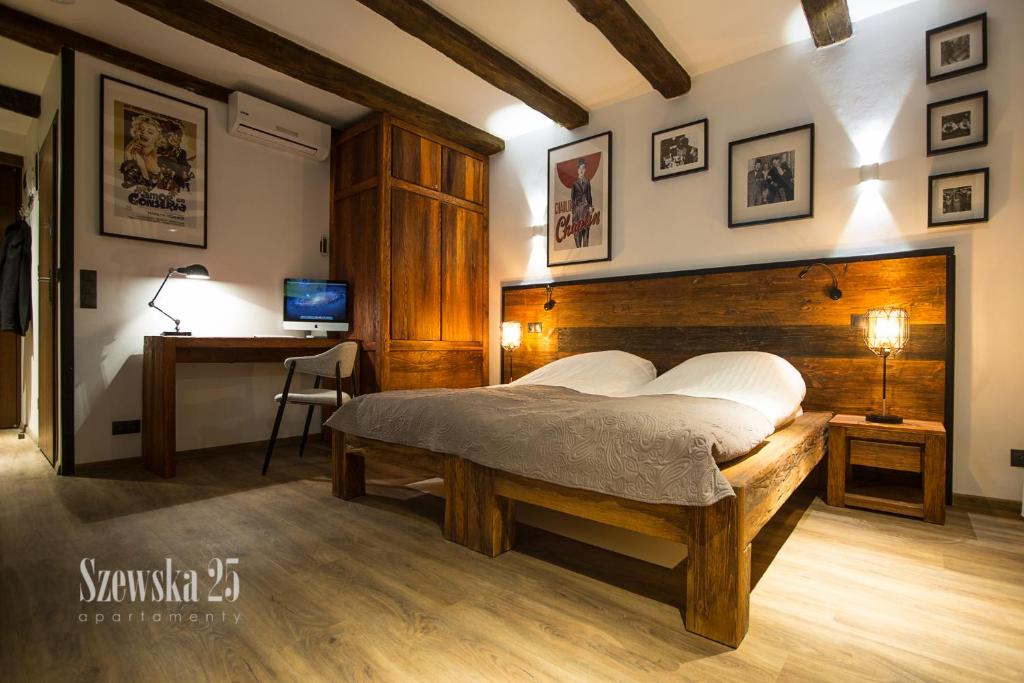 Posteľ alebo postele v izbe v ubytovaní Apartamenty Szewska 25