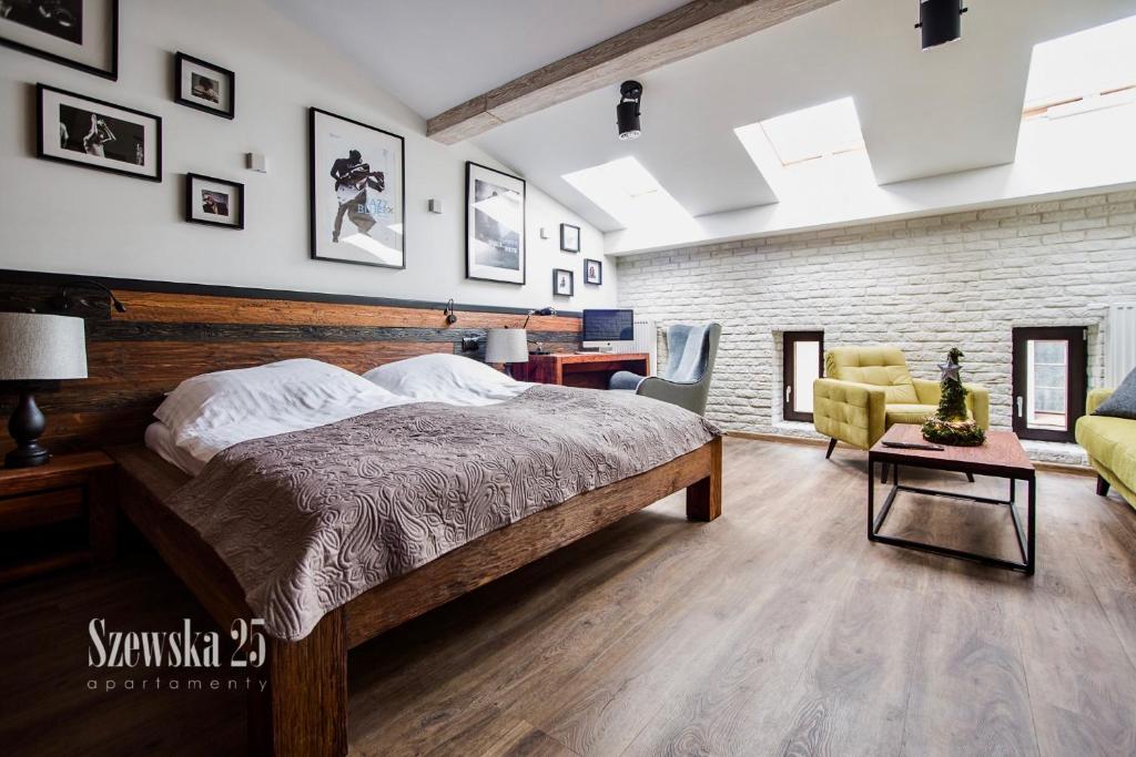 Posteľ alebo postele v izbe v ubytovaní Apartamenty Szewska 25