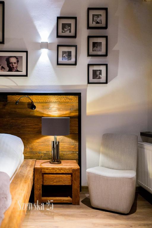 Posteľ alebo postele v izbe v ubytovaní Apartamenty Szewska 25