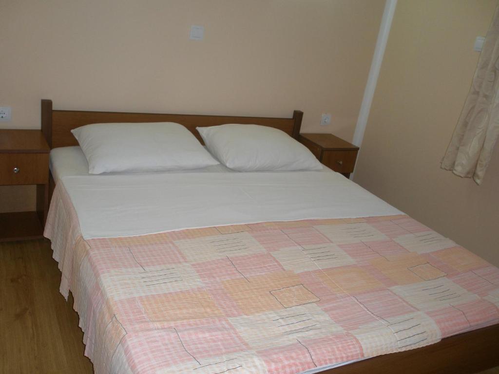 Postel nebo postele na pokoji v ubytování Apartments Aura