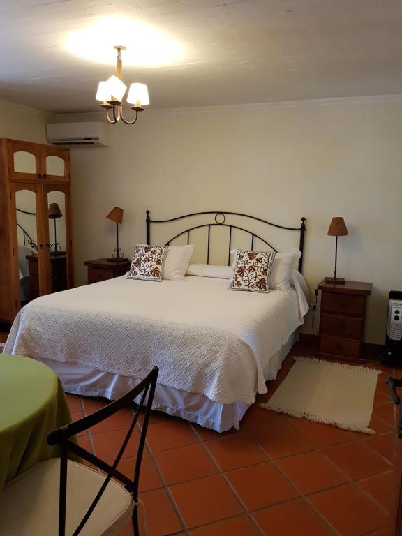 Uma cama ou camas num quarto em Hotel Posada Colchagua