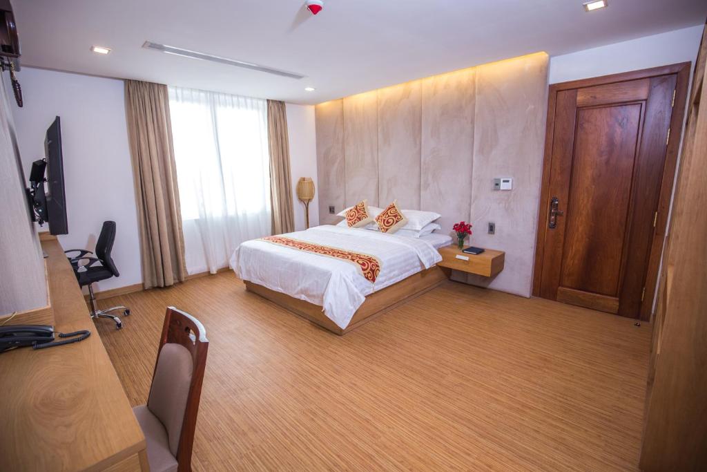 Postel nebo postele na pokoji v ubytování Orussey One Hotel & Apartment