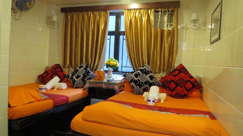 Rúm í herbergi á Paris Guest House (D2, 10/F)