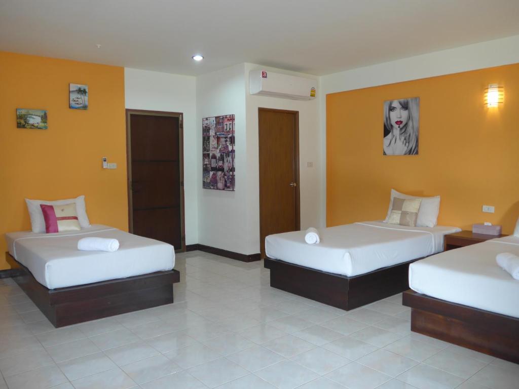 Postel nebo postele na pokoji v ubytování Forum House Hotel Krabi