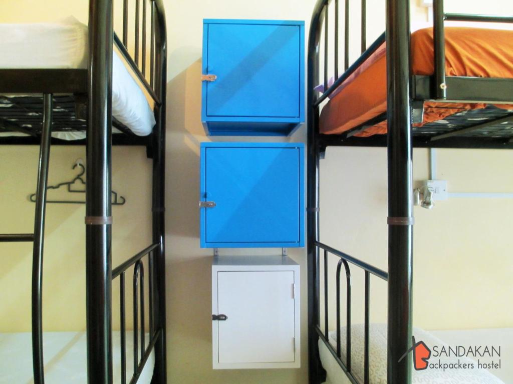 Postel nebo postele na pokoji v ubytování Sandakan Backpackers Hostel