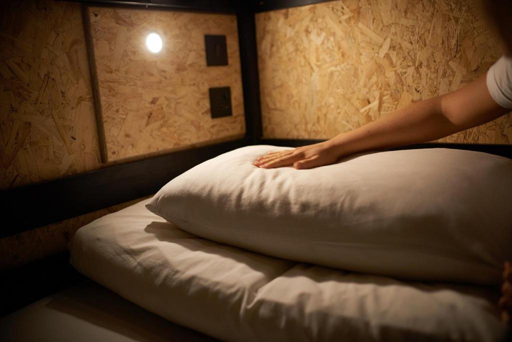 Postel nebo postele na pokoji v ubytování Haystack Hostel