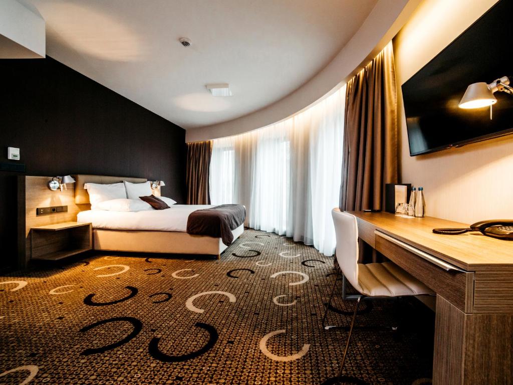 Posteľ alebo postele v izbe v ubytovaní Q Hotel Plus Kraków