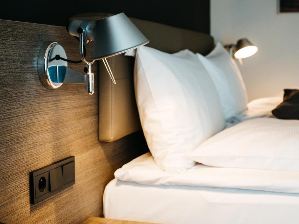 Posteľ alebo postele v izbe v ubytovaní Q Hotel Plus Kraków
