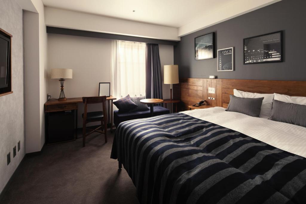 Postel nebo postele na pokoji v ubytování Hotel The Knot Yokohama