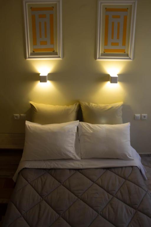 Łóżko lub łóżka w pokoju w obiekcie Bonne Nuit Pension