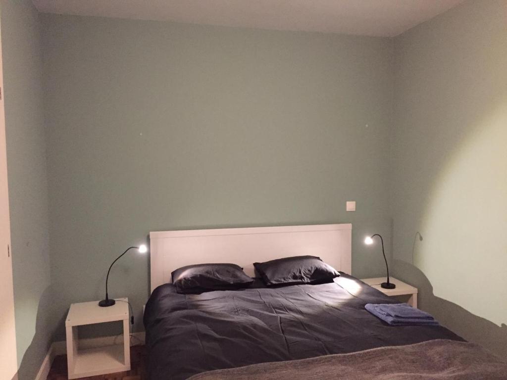 Postel nebo postele na pokoji v ubytování Ribeira Apartment