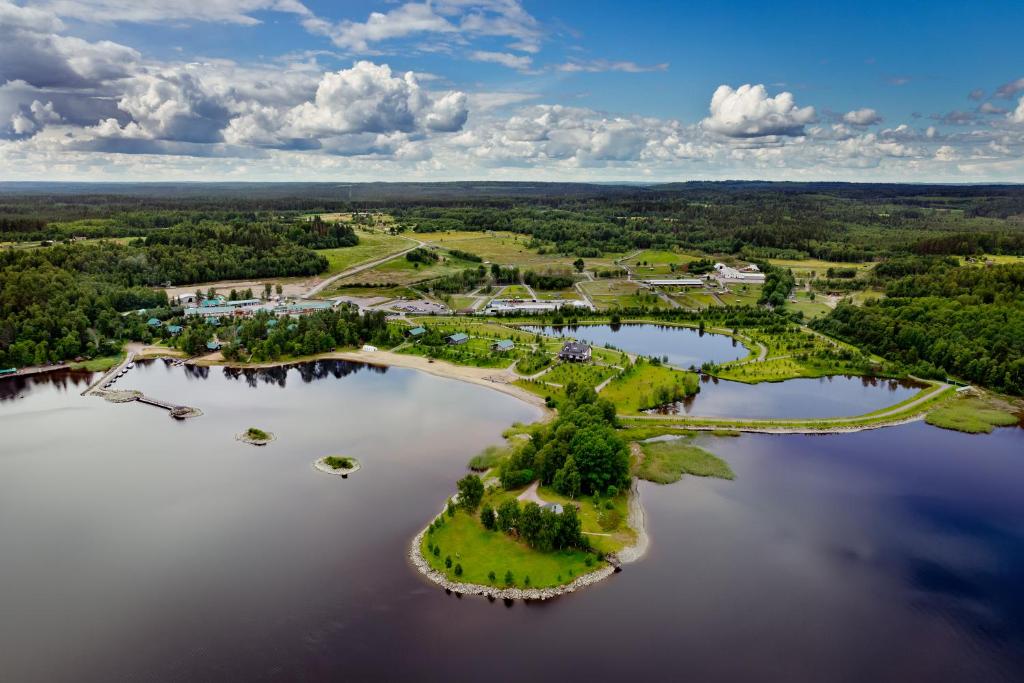 an aerial view of a island in a lake at База отдыха "Черные камни" Коттеджи in Ruskeala