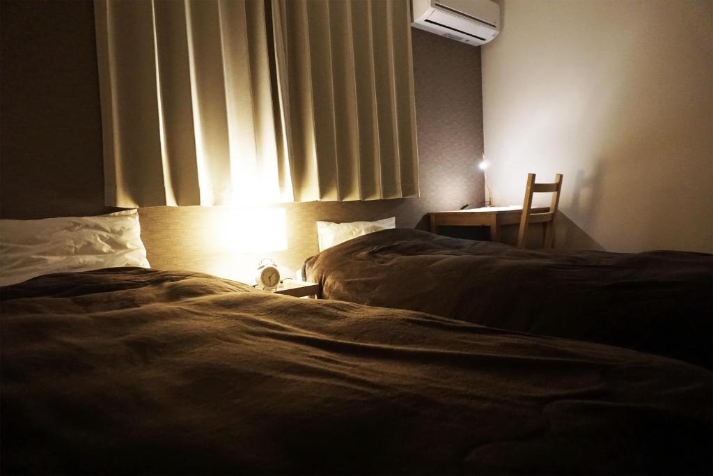Postel nebo postele na pokoji v ubytování Guesthouse 66