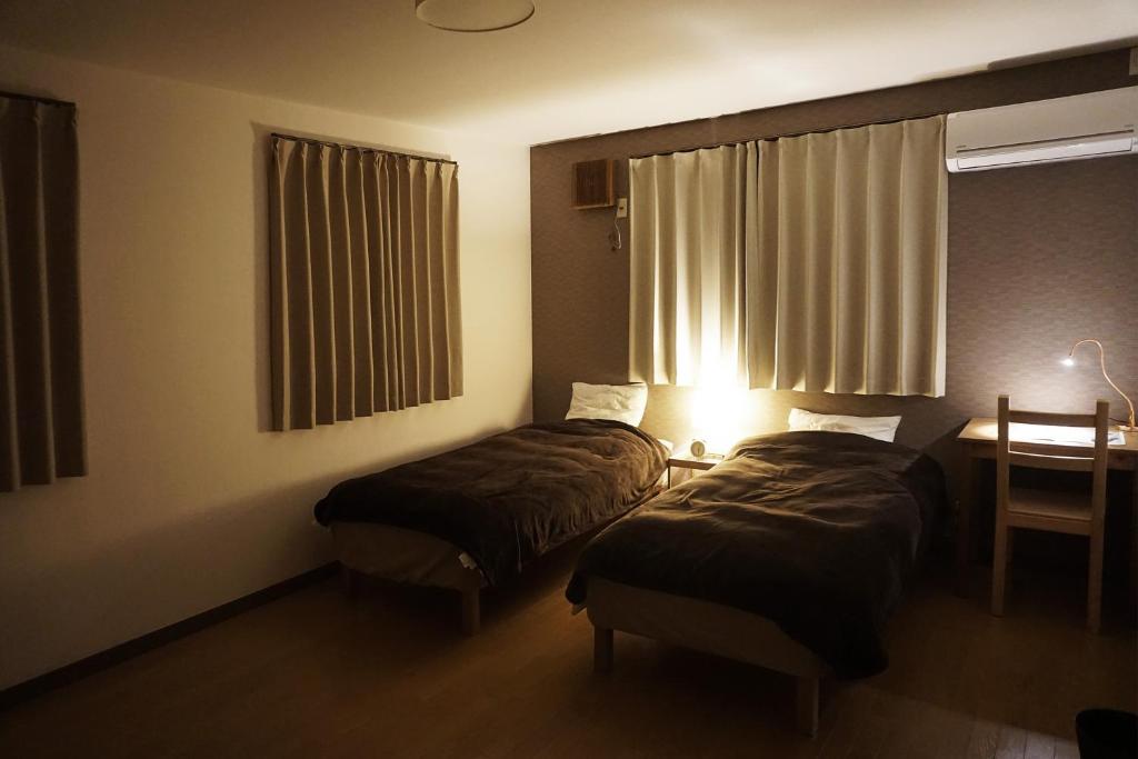Postel nebo postele na pokoji v ubytování Guesthouse 66