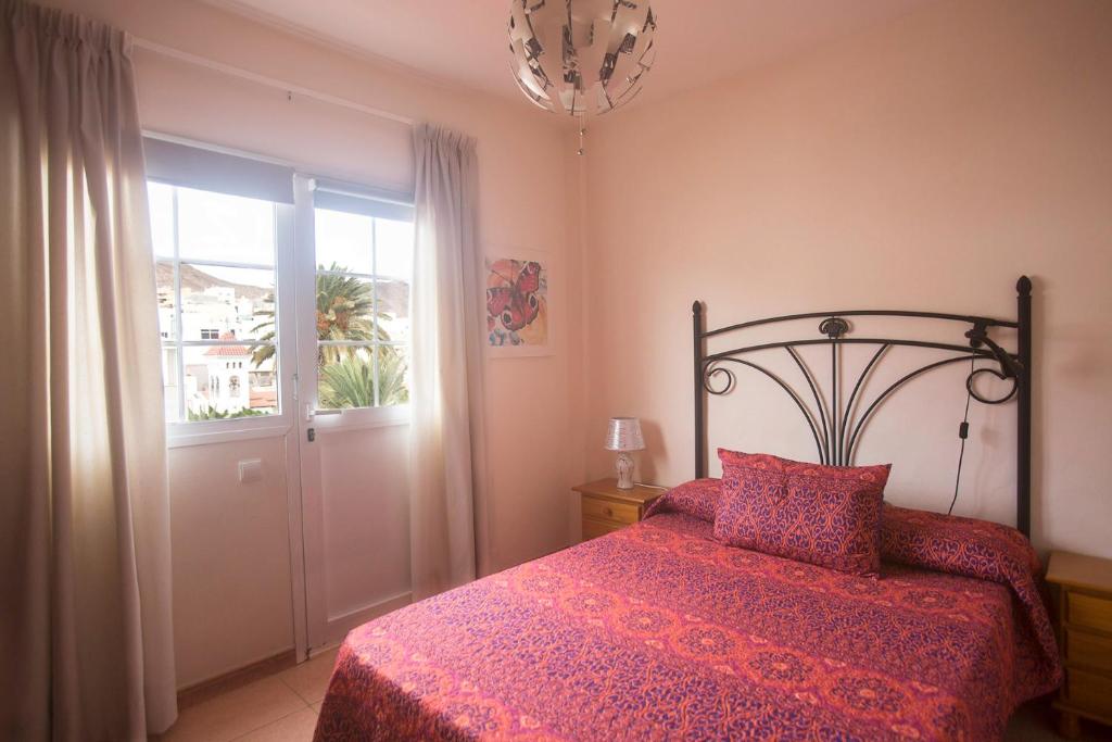 Posteľ alebo postele v izbe v ubytovaní Apartamento con ascensor en primera línea