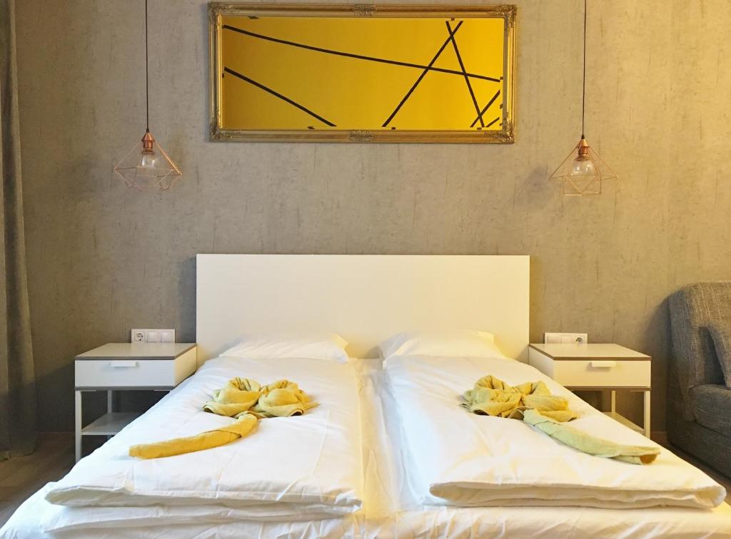 Postel nebo postele na pokoji v ubytování PrimeQ CityCenter Apartments