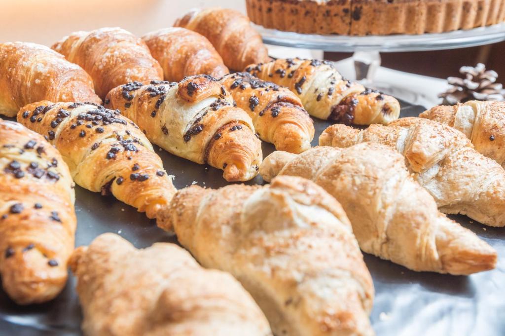 a pile of pastries sitting on top of a table at Hotel Nani Mocenigo Palace in Venice