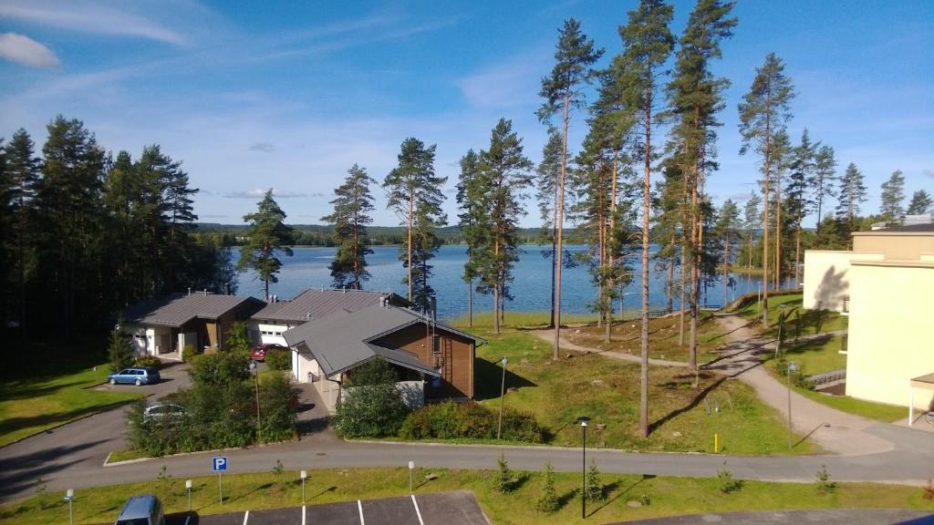 an aerial view of a house next to a lake at Finnclub Voyage Luxury Appartment in Laukaa
