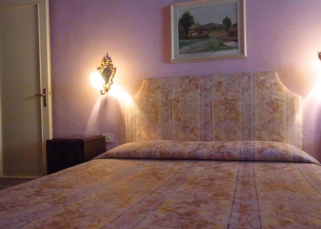Postel nebo postele na pokoji v ubytování Hotel Cestelli
