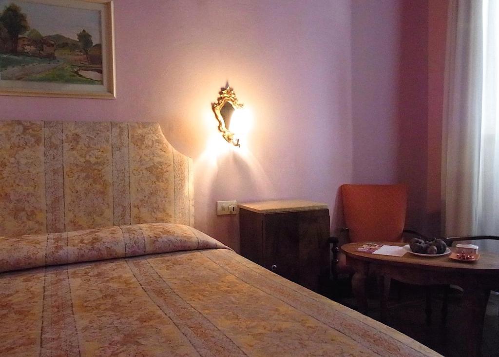 Postel nebo postele na pokoji v ubytování Hotel Cestelli