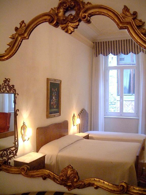 Postel nebo postele na pokoji v ubytování Hotel Cestelli