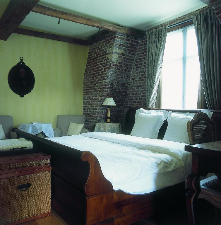 Postel nebo postele na pokoji v ubytování Hotel Recour