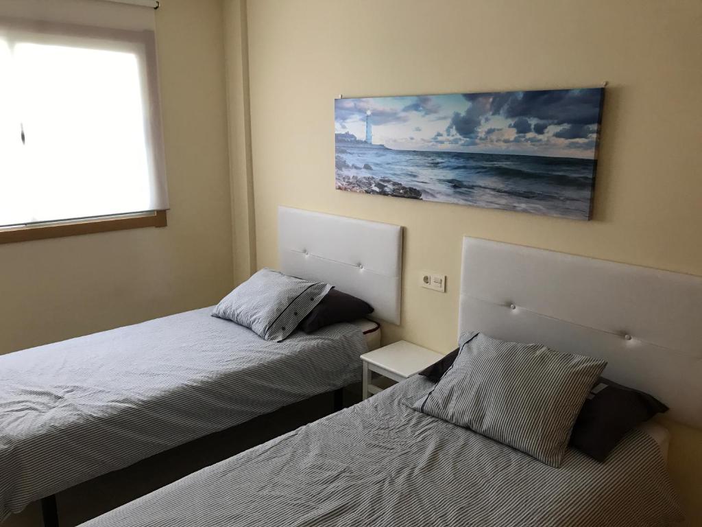 A bed or beds in a room at Maria Perla Medano