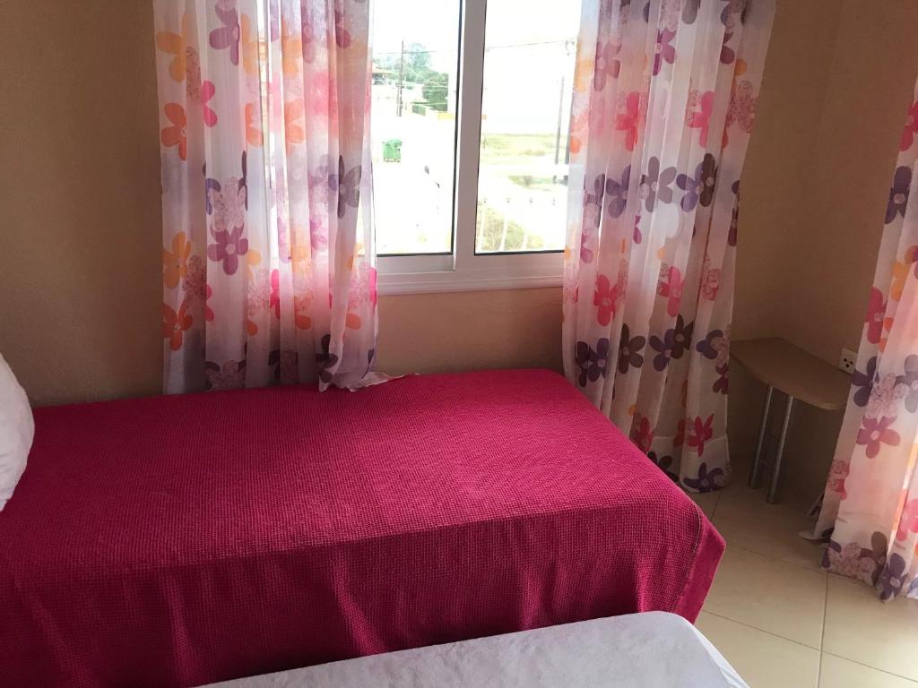 A bed or beds in a room at Theodora Villas