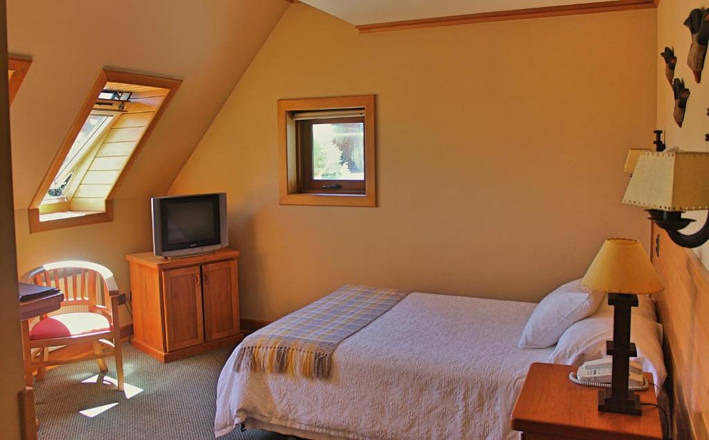 Cama o camas de una habitación en Hotel Puelche