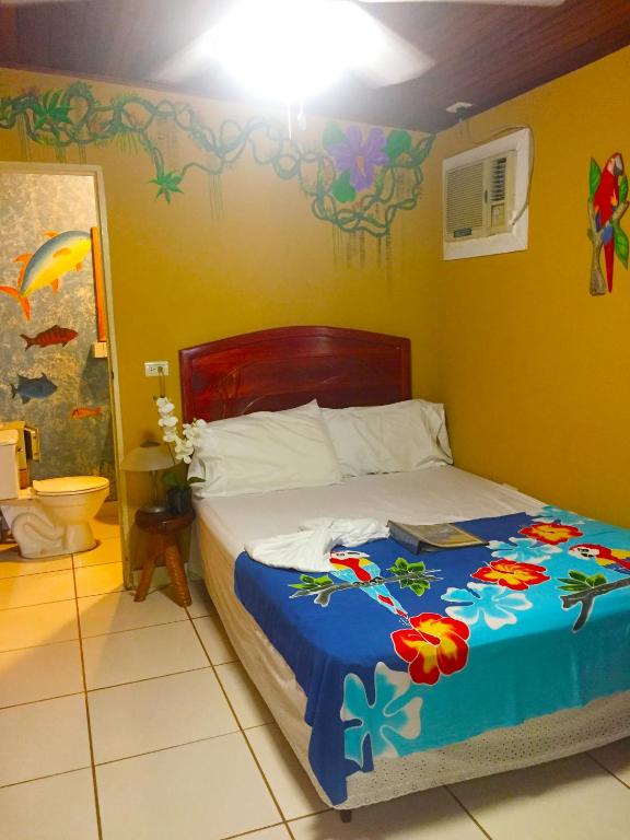 Postel nebo postele na pokoji v ubytování Cabinas Jimenez